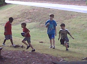 Afterschool Students Enjoy A Game Of Football