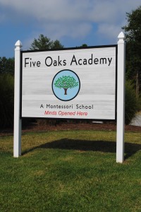 Five Oaks Academy Entry Sign Welcoming Visitors