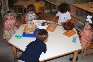 Toddlers Working In Montessori Classroom