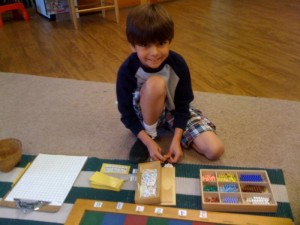 Lower Elementary Student Working With Hand On Material